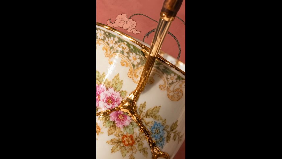 Kintsugi cup repaired with gold